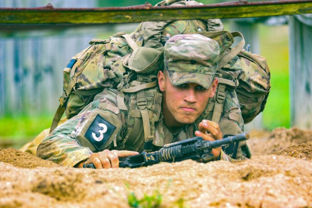 Spc. Justin Earnhart, a human intelligence collector representing U.S. Army Futures Command, completes a hand grenade qualification during the 2021 U.S. Army Best Warrior Competition at Fort Knox, Ky., Oct. 5, 2021. U.S Soldiers and noncommissioned officers test their physical, mental, and combat readiness during the competition through a series of trials including the Army Combat Fitness Test, weapons marksmanship, land navigation and a mystery event. This year's event stands out from previous years by focusing on the total immersion of its competitors in tactical scenarios designed to test their physical and mental toughness. (U.S. Army photo by Staff Sgt. Nicholas Brown-Bell / 4th Cavalry Multifunctional Training Brigade)