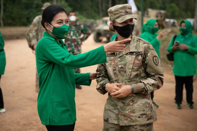 U.S. Army Sgt. Hailey Fairchild, a translator with Task Force Warrior, speaks with Diah Erwiany, wife of Indonesian Gen. Andika Perkasa, during a visit to the Baturaja Training Area, Indonesia, on August 2, 2021. Garuda Shield 21 is a two-week...