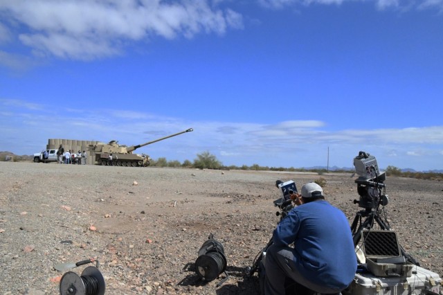 The data collection is critical in developmental testing. High-speed video technician Chris Conner verifies the setting on the camera to ensure it captures video of the projectile as it exits the cannon.