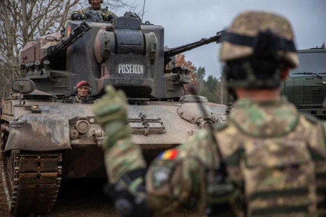 Romanian Land Forces soldiers from Iron Cheetahs position a Gepard during Rifle Forge at Bemowo Piskie Training Area, Poland, Nov. 9, 2021. Rifle Forge was a culminating combined arms live-fire exercise that involves allies from Battle Group Poland. Two new contingent forces joined the Battle Group for this defensive scenario; the Romanian Land Forces Iron Cheetahs and British Army Black Horse Troop. (U.S. Army photo by Pfc. Jacob Bradford)