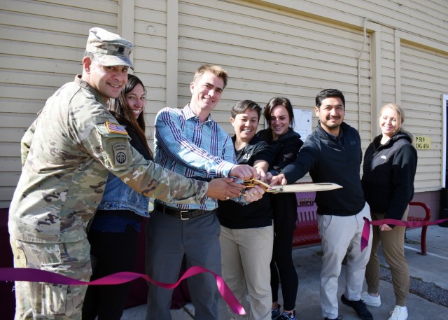 From left, Lt. Col. Kenneth Reed, California Medical Detachment commander; Nicole Gutierrez, physical therapy assistant; Dusty Hurd, supervisor of physical therapy; Minh Sutton, PTA; Bailey Evers, PTA; Jason Sakihara, PTA; and Sarah Aiello, medical support assistant, cut a ribbon to officially open the CalMed Physical Therapy Clinic in its new location in Bldg. 454, Presidio of Monterey, Calif., Nov. 9.