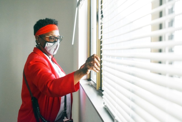 Ruby Sutton, housing manager, Presidio of Monterey Housing Office, ensures windows open and close correctly while inspecting a property in Monterey, Calif., Nov. 5, for the Department of Defense’s Homes.mil website.