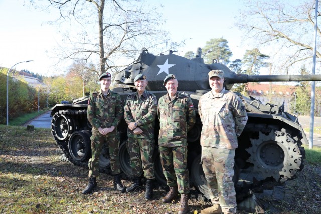 (l to r) Second Lt. Daan Verwaaij (NDL), Maj. Geert Vanhaastrecht (NLD) and Maj. Peter Gijsbers with Capt. Michael McKinney, 21st Theater Sustainment Command, Theater Movements Centerr. In November, 2021, the Dutch Army officers briefed McKinney...
