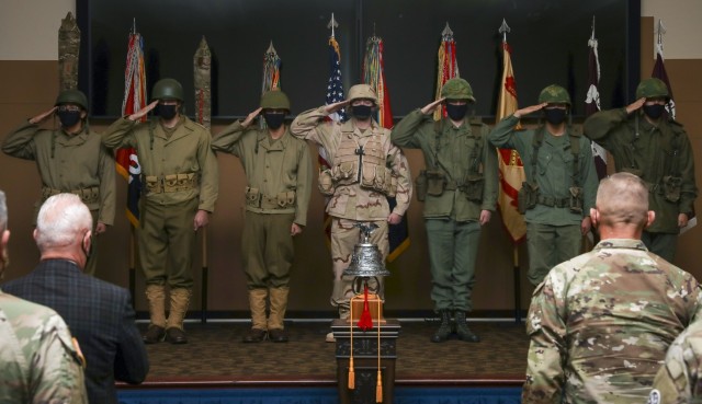 Infantrymen assigned to 3rd Battalion, 66th Armored Regiment, 1st Armored Brigade Combat Team, 1st Infantry Division, salute as they portray 1st Infantry Division Medal of Honor recipients during a commemoration ceremony Nov. 10, 2021, at Fort...