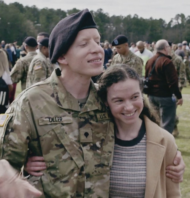 Now Spc. Josh Oller embraces his girlfriend Amariah, after completing Army basic combat training. 