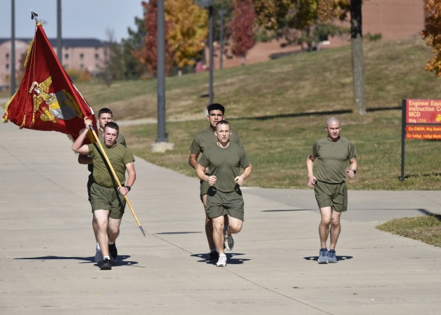 Marine Maj. Daniel Vacchio (center), 1st Sgt. James Grundbacher (right), Lance Cpl. Hunter Hensley (back left), and Pfcs. Clayton Coley (left) and Jordan Melendez (rear center) run the first of 246-miles that Marines stationed here will complete...