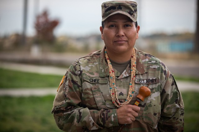 Sgt. Christina Chee, a water treatment specialist assigned to Alpha Company, 46th Aviation Support Battalion, poses for a photo with a traditional gourd and necklace while showcasing symbolic Navajo items during National Native American Heritage Month at Joint Base Lewis-McChord, Wash., Nov. 8, 2021. Chee is a member of the Navajo Tribe of Monument Valley, Utah and a second-generation Soldier.
(U.S. Army Photo by Staff Sgt. ShaTyra Reed, 16th Combat Aviation Brigade)