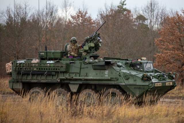 U.S. Army Soldiers with 3rd Battalion, 161st Infantry Regiment, move an Infantry Carrier Vehicle (ICV) "Stryker" into staging position during Rifle Forge, a live-fire exercise at Bemowo Piskie Training Area, Poland, Nov. 8, 2021. The exercise tested deployment readiness and multinational interoperability, demonstrating NATO deterrence. (U.S. Army photo by Pfc. Jacob Bradford)