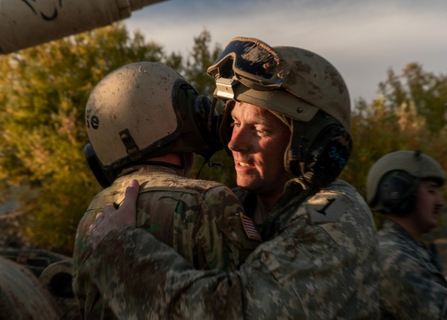 Sgt. 1st Class Jesse Boell (right), a platoon sergeant with 3rd Platoon, Charlie Company “Bandidos,” 1st Battalion, 16th Infantry Regiment, 1st Armored Brigade Combat Team, 1st Infantry Division, congratulates Sgt. Kyler Gullage, an M1 armor crewman also with 3rd platoon, after completing the battle damage assessment and repair evaluation during the Hellenic Tank Challenge 2021 at Triantafyllides Camp, Greece, Nov. 3, 2021. The Hellenic Tank Challenge 2021 is a competition under Atlantic Resolve that enables tank platoons from the United States and Greece to compete against each other while building partnership capabilities. 