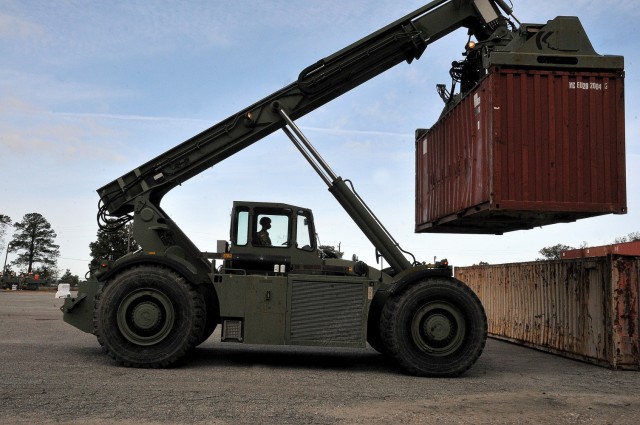 A student operator moves a container using the RT240 during 88H Cargo Specialist Course training Oct. 28 at Joint Base Langley-Eustis, Va. The RT240 is one of several cargo handling machines students are required to operate in training. They receive additional instruction and certifications at their units of assignment. (U.S. Army photo by T. Anthony Bell)
