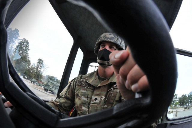 Spc. Jaime L. Feliciano Rodriguez gets set to operate an RT240 during 88H Cargo Specialist Course training Oct. 28 at Joint Base Langley-Eustis, Va. The course is an offering of the Army Transportation School’s Maritime and Intermodal Training...