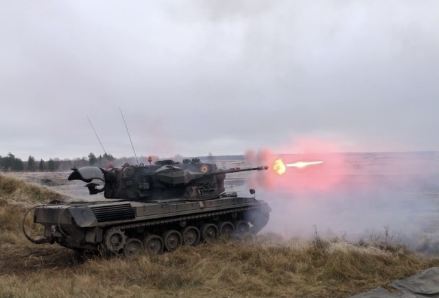 Romanian Land Forces soldiers from Iron Cheetahs fire a Gepard during Rifle Forge at Bemowo Piskie Training Area, Poland, Nov. 9, 2021. Rifle Forge was a culminating combined arms live-fire exercise that involves allies from Battle Group Poland. Two new contingent forces joined the Battle Group for this defensive scenario; the Romanian Land Forces Iron Cheetahs and British Army Black Horse Troop. (U.S. Army photo by Pfc. Jacob Bradford)