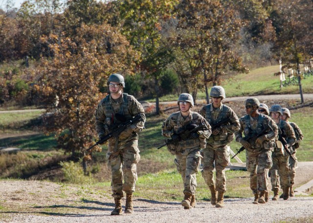 Cadets from the University of Iowa, in Iowa City, Iowa, walk to get ammunition on Friday before attempting to qualify with M4 carbines during the 3rd Brigade Army ROTC Ranger Challenge, held here Friday and Saturday.