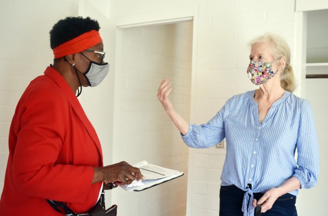Ruby Sutton, left, housing manager, Presidio of Monterey Housing Office, inspects a property for the Department of Defense’s Homes.mil website in San Benancio Canyon, Calif., Nov. 5. Kathleen Eckerson Ivie, the landlord, talks to Sutton about...