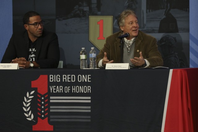 Dr. Steven Short (right), a board certified pulmonary, critical care and sleep medicine physician, speaks during a virtue panel discussion held by the 1st Infantry Division and Fort Riley as a part of its Big Red One Year of Honor observance Nov....