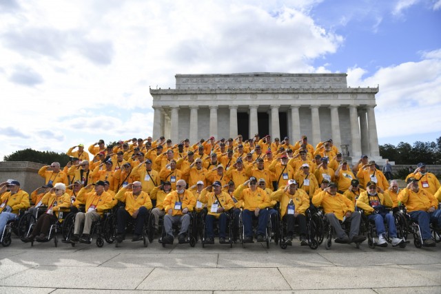 A group of veterans from Illinois and Iowa salute for a photo at the Lincoln Memorial in Washington Nov. 4, 2021. The veterans visited Arlington National Cemetery, the Lincoln Memorial, Vietnam Veterans Memorial, Korean War Veterans Memorial and...
