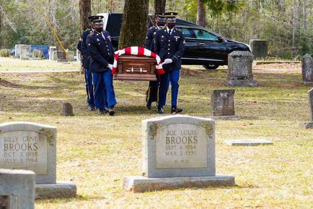A Louisiana National Guard Military Funeral Honors Team escorts a fallen Soldier during his internment ceremony, March 13, 2021. Over the last year, the team proudly rendered honors at more than 1,500 veterans’ funerals, honoring them for their...