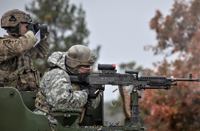 A Soldier with the 2nd Squadron, 106th Cavalry (2-106) of the Illinois National Guard fires a machine gun at a target Oct. 21, 2021, at a live-fire range at Fort McCoy, Wis. During their training on post in October, 2-106 Soldiers completed...