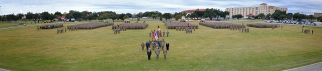 The U.S. Army Medical Center of Excellence (MEDCoE) Command Team, Maj. Gen. Dennis LeMaster (front center), Mr. Joseph Harmon III (front left) and Cmd. Sgt. Maj. Clark Charpentier (front right) hosted a group photo with over 4,000 Soldiers and Civilians gathered on MacArthur Field, JBSA-Fort Sam Houston prior to the 32d Medical Brigade Change of Command, November 10, 2021. For MEDCoE, who celebrated their Centennial Anniversary in 2020 with very little fanfare due to the global COVID-19 pandemic, the change of command was the first opportunity to gather such a large group in representation of the command. With improving local COVID-19 conditions, masks were not required for vaccinated personnel during the outdoor ceremony. 