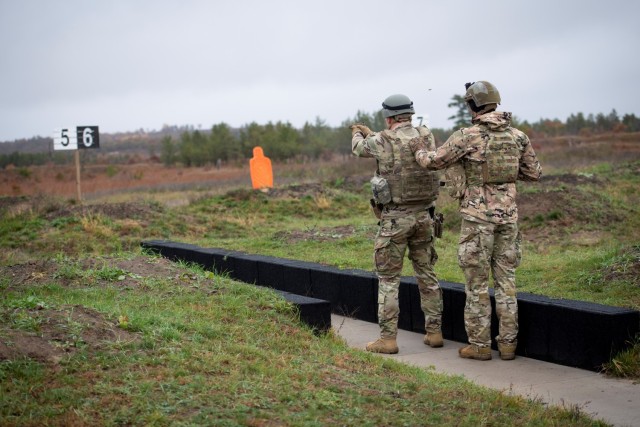 A Soldier with the 2nd Squadron, 106th Cavalry (2-106) of the Illinois National Guard fires a M9 pistol at a target Oct. 21, 2021, at a live-fire range at Fort McCoy, Wis. During their training on post in October, 2-106 Soldiers completed...