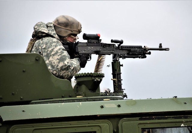 A Soldier with the 2nd Squadron, 106th Cavalry (2-106) of the Illinois National Guard fires a machine gun at a target Oct. 21, 2021, at a live-fire range at Fort McCoy, Wis. During their training on post in October, 2-106 Soldiers completed...
