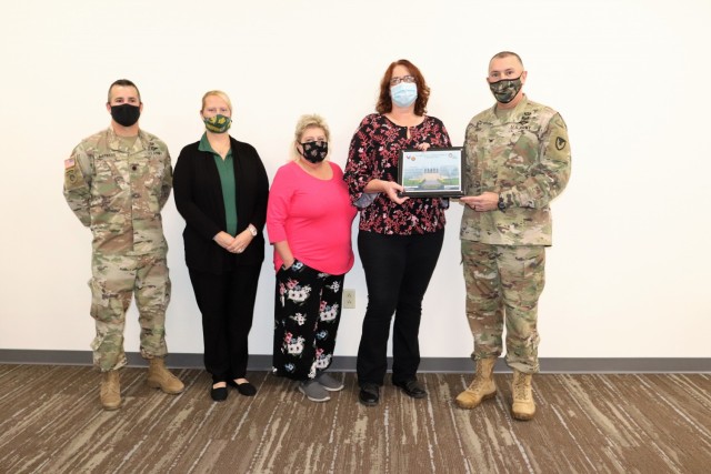 Members of the Fort McCoy Army Community Service office are shown being recognized for excellence Nov. 4, 2021, in the Installation Emergency Operations Center by Deputy Garrison Commander Lt. Col. Chad Maynard and Fort McCoy Garrison Commander...
