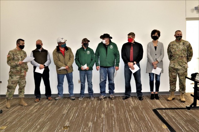 Members of the Fort McCoy workforce are shown being recognized for excellence Nov. 4, 2021, in the Installation Emergency Operations Center by Deputy Garrison Commander Lt. Col. Chad Maynard and Fort McCoy Garrison Commander Col. Michael Poss....