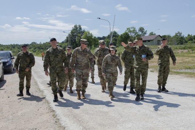Army Brig. Gen. Steven J. Kremer, assistant adjutant general for readiness of the Iowa National Guard, and Army Maj. Gen. Johanna P. Clyborne, assistant adjutant general of the Minnesota National Guard, speak with Croatian leaders at the Croatian Armed Forces Best Soldier Competition at the Eugen Kvaternik Military Training Area in Slunj, Croatia, June 16, 2021. (U.S. Army National Guard photo by Sgt. Samantha Hircock)