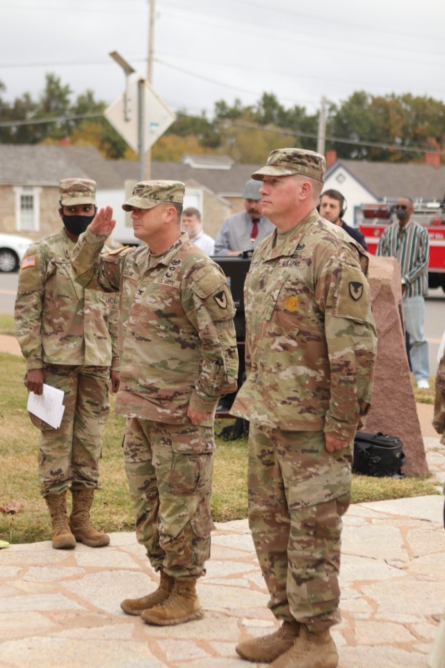 Col. Rhett Taylor salutes and Command Sgt. Maj. William Taylor stands at attention as they prepare to walk to the color guard in front of Taylor Hall and begin the guidon exchange at the command sergeant major’s assumption of responsibility ceremony Nov. 10, 2021.