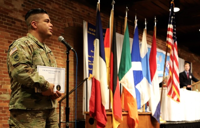 SFC Javier Perez Cosme is formally recognized during the Columbus Rotary Club MoH COL (RET) Ralph Puckett Soldier of the Week program. Perez has served the Nation for 22 years in a multitude of leadership positions. US Army Photo by SGT Vladimir Varlack