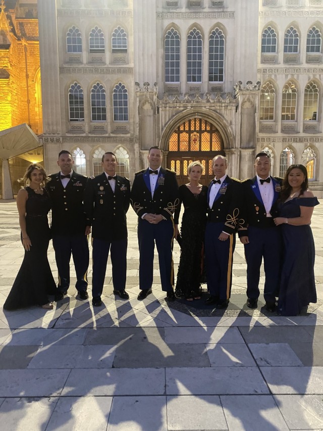 From left, Falicia Ramos, Chief Warrant Officer 2 Irvin Hernandez, Chief Warrant Officer 2 Bradley Hlebain, Chief Warrant Officer 5 Joe Rosamond, Jill Goding, Chief Warrant Officer 5 Kipp Goding, Warrant Officer 1 Ge Xiong and Pangia Xiong pose...