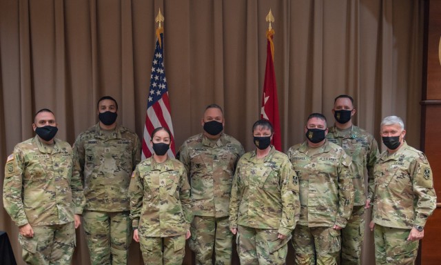 Maj. Gen. James Bonner, Maneuver Support Center of Excellence and Fort Leonard Wood commanding general (right), and MSCoE and Fort Leonard Wood Command Sgt. Maj. Randolph Delapena (left) pose for a photo with the winners of the fiscal year 2021...
