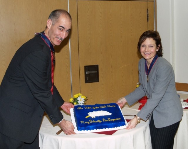 Dan Gasparino and fellow-IMCOM-Europe employee Mary Schweitzer are honored with the White Plume Award in 2008. The award was presented for continually improving the quality of life for Soldiers and Families through their extensive experience and knowledge in the morale, welfare and recreation arena.