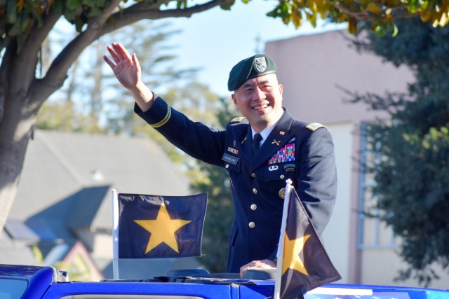 Col. Varman Chhoeung, commander of U.S. Army Garrison Presidio of Monterey, waves to the crowd during the 11th Annual Veterans Day Parade in Salinas, Calif., Nov. 11.