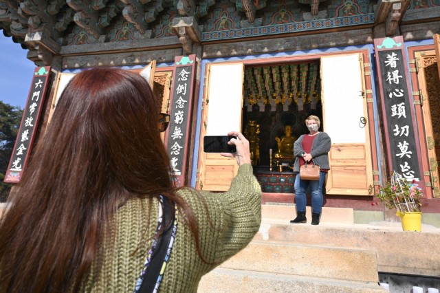 Kelly Lesperance takes a photo of Theresa Carns at Silleuksa Temple Nov. 15, 2021, during a cultural tour in Yeoju South Korea. (Photo by Monica K. Guthrie)