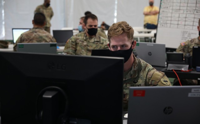 U.S. Army CPT Erik Doering, assigned to the 1st Multi-Domain Task Force, works on network capabilities in preperation for Project Convergence at Yuma Proving Grounds, Arizona on October 14, 2021. (U.S. Army photo by Spc Destiny Jones)