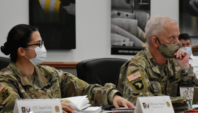 Col. Santee Vasquez and Col. Michael Hammond, the commanders of Crane Army Ammunition Activity and McAlester Army Ammunition Plant, respectively, listen as Brig. Gen. Gavin Gardner, commanding general of U.S. Army Joint Munitions Command, addresses the leaders of the ammunition Organic Industrial Base at JMC’s Commanders Forum Oct. 26. The conference focused on how JMC, the entity responsible for providing all conventional munitions for the U.S. military, and its 17 subordinate commands that make up the ammunition OIB, are transforming together to increase readiness for the warfighter and modernize for the 21st century-environment. 