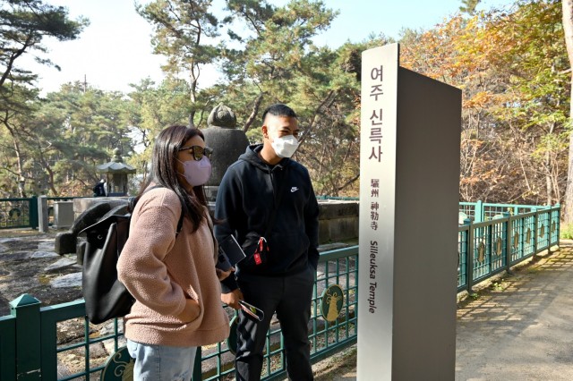 Sgt. Erickson Ternola (right), from Company B, 194th Division Sustainment Support Battalion, 2nd Infantry Division Sustainment Brigade, and his wife Yael read historical markers at the Silleuksa Temple in Yeoju, South Korea, Nov. 15, 2021. (Photo by Monica K. Guthrie)