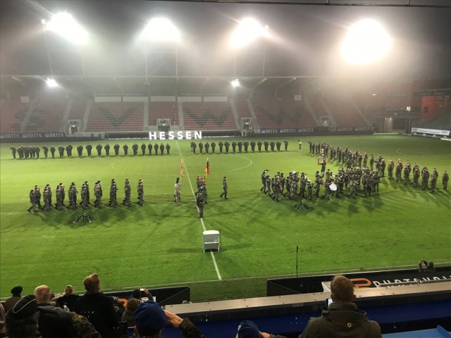 WIESBADEN, Germany - The USAG Wiesbaden Community Color Guard (middle) marching into the BRITA Arena alongside their German army counterparts during the Bundeswehr Pledge ceremony on Friday, Nov. 12.