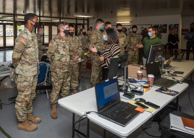 Trainees from Company B, 169th Engineer Battalion, speak with geospatial industry partners at a GIS Day event in Brown Hall. Short for Geographic Information System, GIS Day is celebrated by the geospatial community each year, and provides an...