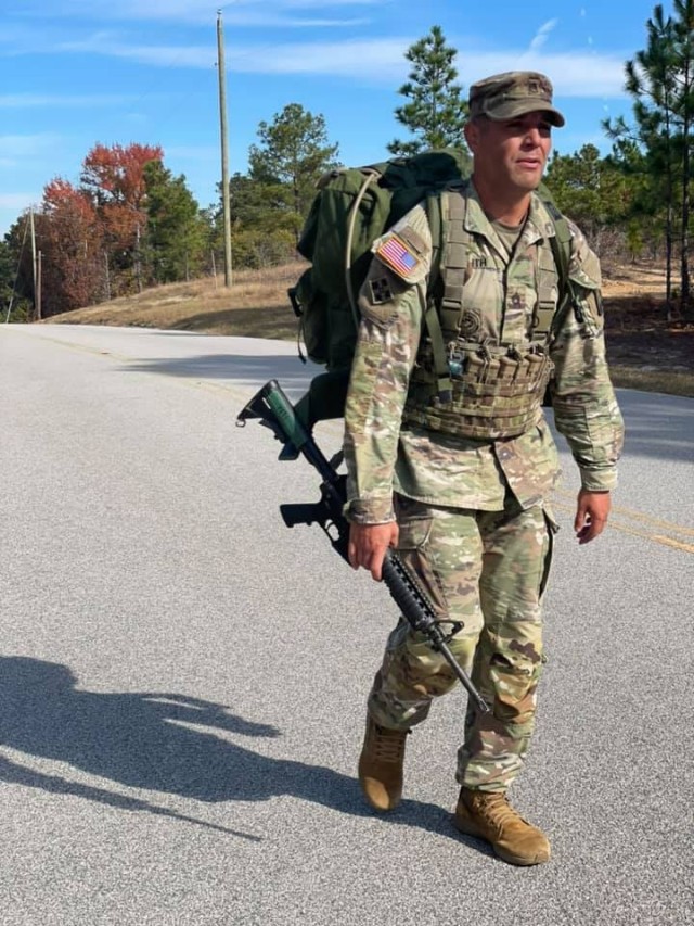 A drill sergeant with 1st Battalion, 34th Infantry Regiment conducts a ruck march as part of the unit’s Drill Sergeant of the Cycle competition that pitted five drill sergeant against each other in a series of arduous set of tasks aimed at...