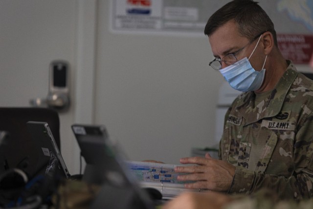 Chief Warrant Officer 2 Ferencz Babinszki, 249th Engineer Battalion Charlie Company Prime Power mission commander, operates in an emergency operations center during Exercise Empire Rising 2021 in Baltimore, Md., July 15, 2021. Empire Rising is a...