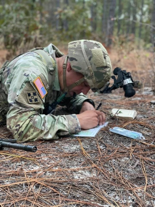 A drill sergeant with 1st Battalion, 34th Infantry Regiment plots a point during land navigation as part of the unit’s Drill Sergeant of the Cycle competition that pitted five drill sergeant against each other in a series of arduous set of tasks...