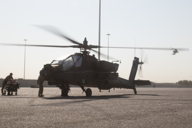 AH-64E Apache helicopters assigned to the Fort Bragg, North Carolina, based 82nd Combat Aviation Brigade, 82nd Airborne Division, land at the Port of Shuaiba, Kuwait, Nov. 10, 2021, in preparation for retrograde operations.  The Aberdeen Proving Ground, Maryland, based 1100th Theater Aviation Sustainment Maintenance Group oversaw the preparations for the retrograde of more than 30 aircraft assigned to the 82nd CAB from Nov. 7-12. The Soldiers and aircraft were deployed to Afghanistan to support base closures and the U.S. military’s exit from the Hamid Karzai International Airport in Kabul.