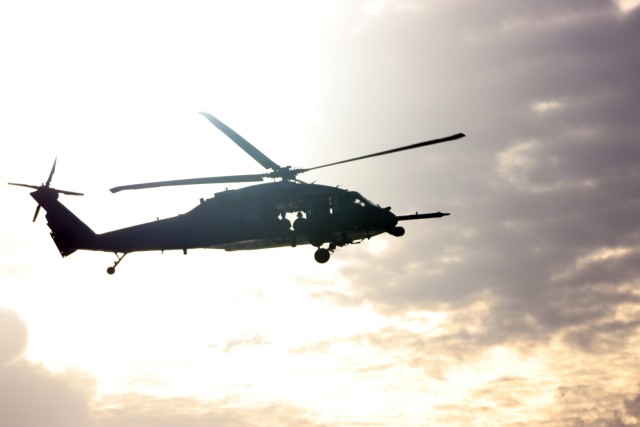 A HH-60G Pave Hawk helicopter, assigned to the 33rd Rescue Squadron, flies over head  during joint training off the cost of Okinawa, Japan, 10 Nov. The exercise allowed both Army and Air Force units to hone their skills and cross-train to get a better understanding of how each other operates.