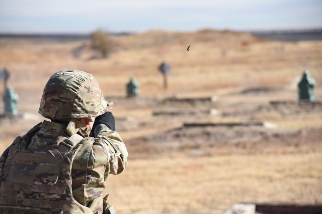 Maj. David Leydet, a training and operations officer with 1st Space Battalion, 1st Space Brigade, U.S. Army Space and Missile Defense Command, fires his M17 pistol downrange for his pistol qualification at Fort Carson, Colo, Nov. 9, 2021. (U.S. Army photo by Sgt. 1st Class Aaron Rognstad/RELEASED)