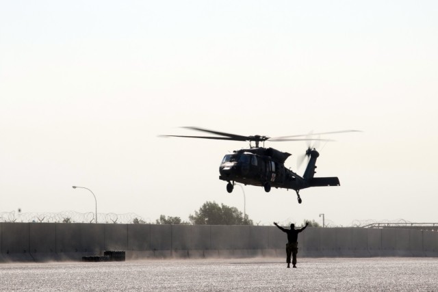 An UH-60M Black Hawk helicopter assigned to the Fort Bragg, North Carolina, based 82nd Combat Aviation Brigade, 82nd Airborne Division, lands at the Port of Shuaiba, Kuwait, Nov. 10, 2021, in preparation for retrograde operations. The Aberdeen Proving Ground, Maryland, based 1100th Theater Aviation Sustainment Maintenance Group oversaw the preparations for the retrograde of more than 30 aircraft assigned to the 82nd CAB from Nov. 7-12. The Soldiers and aircraft were deployed to Afghanistan to support base closures and the U.S. military’s exit from the Hamid Karzai International Airport in Kabul.
