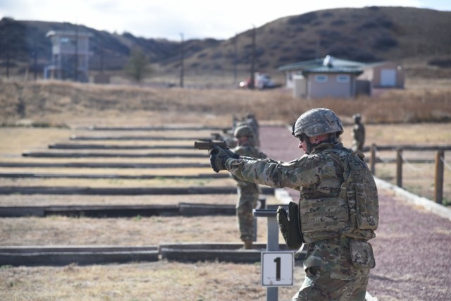 Soldiers of 1st Space Battalion, 1st Space Brigade, U.S. Army Space and Missile Defense Command, fire their M17 pistols downrange for their pistol qualification at Fort Carson, Colo, Nov. 9, 2021. (U.S. Army photo by Sgt. 1st Class Aaron Rognstad/RELEASED)