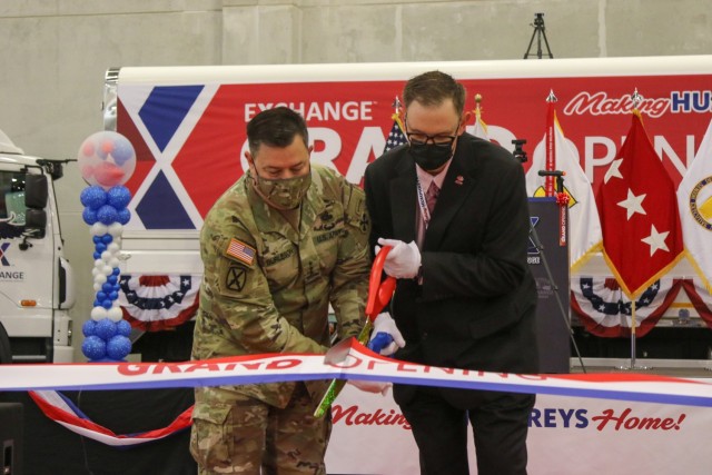 Lt. Gen. Bill Burleson, Eighth Army commanding general, and Scott Bonner, Exchange Pacific Regional vice president, cut the ceremonial ribbon during a grand opening of the new Army and Air Force Exchange Service Korea Distribution Center and bakery on U.S. Army Garrison Humphreys, South Korea, Nov. 19, 2021. (U.S. Army photo by Cpl. Lee, Dong-ki)