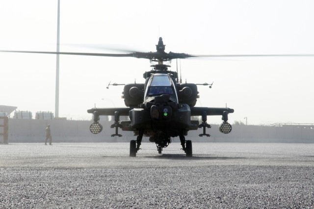 An AH-64E Apache helicopter assigned to the Fort Bragg, North Carolina, based 82nd Combat Aviation Brigade, 82nd Airborne Division, lands at the Port of Shuaiba, Kuwait, Nov. 10, 2021, in preparation for retrograde operations. The Aberdeen Proving Ground, Maryland, based 1100th Theater Aviation Sustainment Maintenance Group oversaw the preparations for the retrograde of more than 30 aircraft assigned to the 82nd CAB from Nov. 7-12. The Soldiers and aircraft were deployed to Afghanistan to support base closures and the U.S. military’s exit from the Hamid Karzai International Airport in Kabul.
